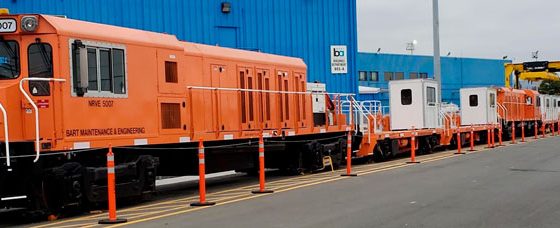 A 14-railcar maintenance train sits in a railyard.