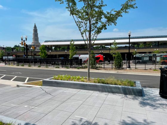 Looking south across Diagonal Street at the passenger pick-up and drop-off, taxi, ride-sharing, and shuttle area of the King Street - Old Town Metro station in Alexandria, Va.
