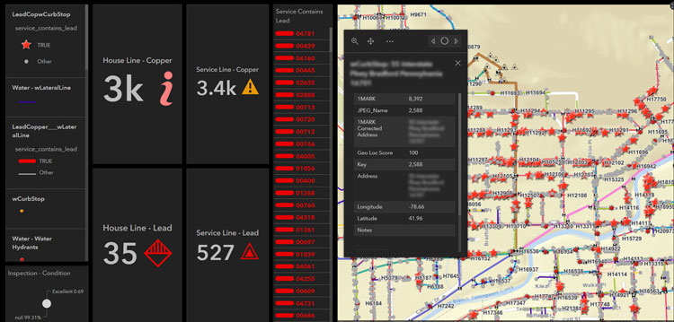 A computer dashboard shows a pale yellow map with red stars pinpointing service lines.